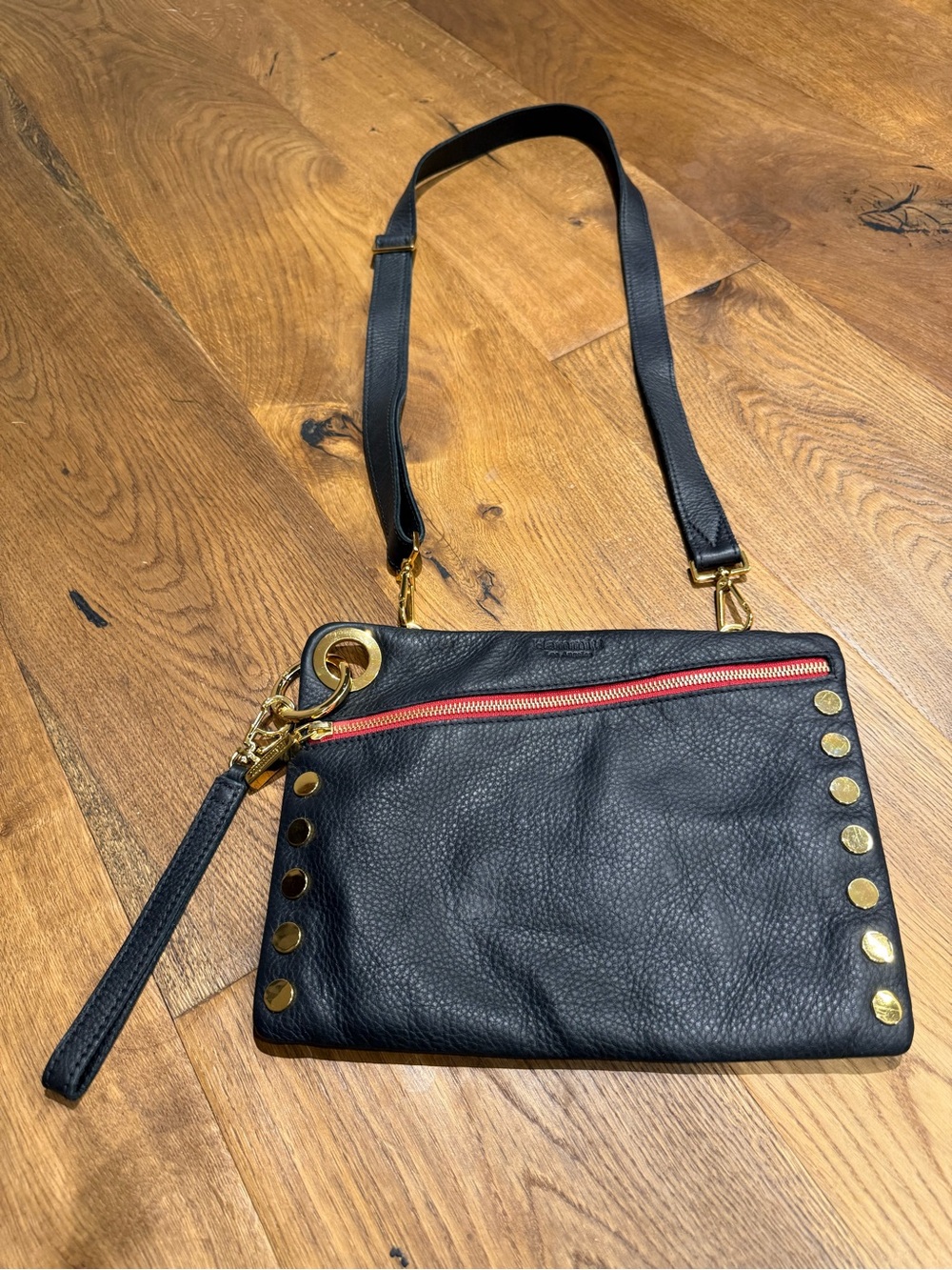 Classic Hammitt Nash in soft black pebbled leather with red zipper detail